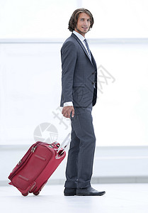 people带行李的英俊商务人士白色男人工作生意人商务人士成人旅行职业游客背景