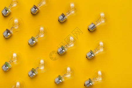 带有灯泡的抽象创作背景摘要创造力创新家庭玻璃领导活力电气橙子黄色照明图片