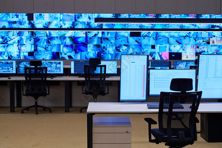监视器展示大型现代安保系统控制室的空内置安全系统控制室椅子展示商业视频互联网机构物流警报控制板车站背景