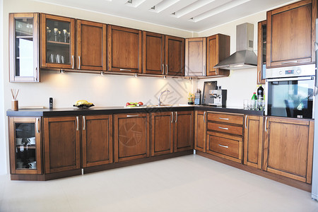 空岛新住宅中现代厨房室内设计现代化财产柜台房子木头公寓家具器具奢华烹饪地面背景
