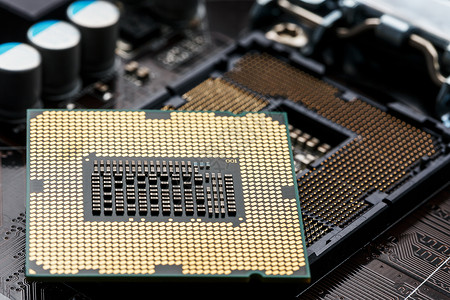 英特尔特写 CPU 芯片处理器 选择性焦点单元电气芯片别针卡片电路科学金子插座技术背景