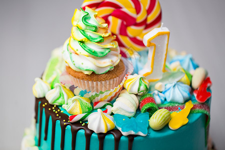 摩丝生日儿童一岁生日的多彩蛋糕背景