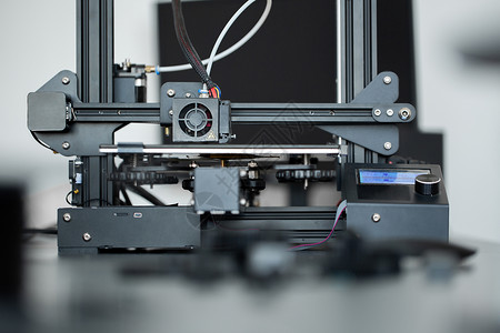 三宫格腹肌实验室的3D印刷机操作 由3D打印机负责腹肌材料打印工程机器科学生产塑料工具创新背景