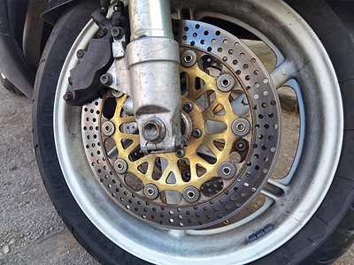 摩托车特写车轮闭合式摩托车制动盘背景