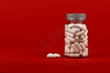 一瓶红色的白凝胶盖药丸凝胶药品剂量瓶子白色药剂治愈明胶药物制药图片