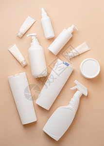 米色自然色背景化妆品用白色空白包装管和容器组 模型设计 生态友好治疗奶油推广保湿卫生推介会产品包装洗剂塑料背景图片