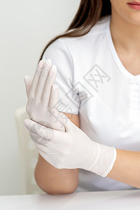 女性用手戴上防护手套医疗保健医院实验室美容产品卫生护理身体科学图片