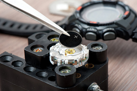 可替换镜头替换钟表电池硬币替代品设备活力服务圆圈手表金属圆形锂离子背景