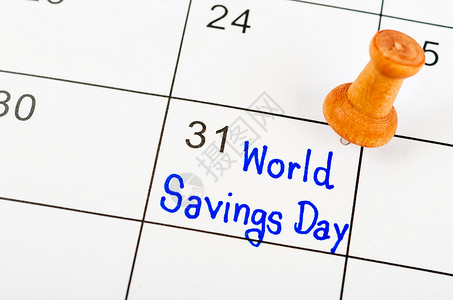 个人贷款海报手写世界储蓄日 白日历上挂着木针背景
