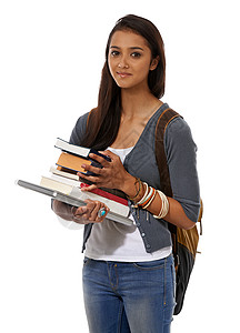 故宫上新了准备上新学期了 一个年轻的少数民族妇女拿着笔记本电脑和一堆书背景