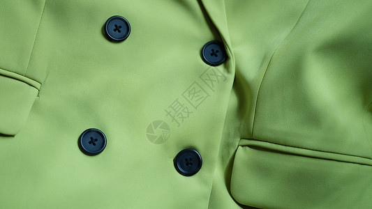 浅绿色外套黑色扣紧闭的浅绿色上衣衬衫背景