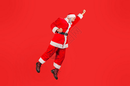 红色背景的情感圣诞老人条款庆典热情老年成功派对空气男人优胜者假期超级英雄背景图片