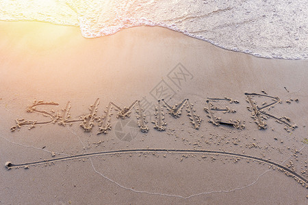 夏日在夕阳下沙沙滩上的沙子上晴天海浪海滩刻字天堂场景海洋异国热带旅行图片