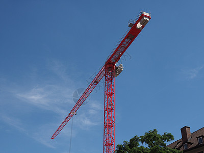 红色建筑起重机蓝色作品工业天空悬载技术工作财产建造工具背景图片