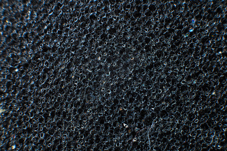 黑色气泡素材在浅深的田地上封闭包装软黑色材料 聚乙烯泡沫的前卫背景抽象纹理; 多氯乙烯泡沫背景
