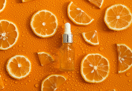 血清滴瓶装化妆品和液滴 润滑橙 高压酸 选择性焦点橙子科学产品治疗液体润肤香气护理生物皮肤背景