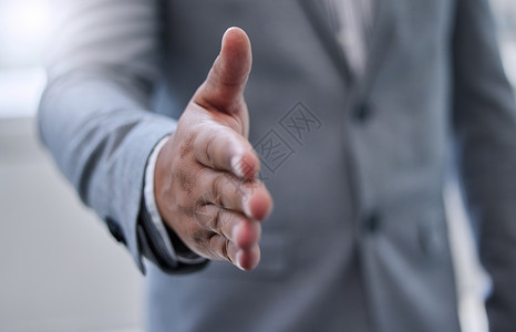 多坚固的握手 一个商务人士伸出手来握手高清图片