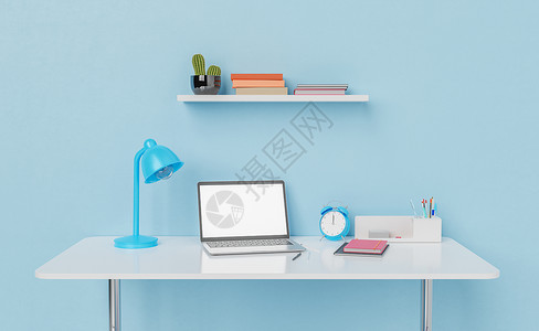 蓝色电脑背景手持灯和闹钟的工作桌上的手提电脑背景