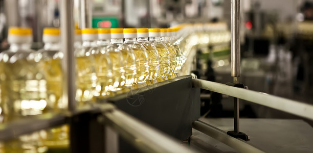 生产食用油的工厂 浅色DOFF 乌克兰建筑腰带瓶子油厂技术植物生产线饮食流程向日葵背景