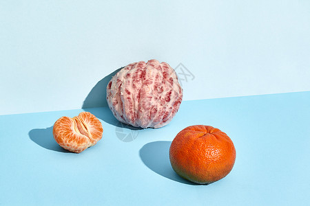 普通普通话和一半葡萄油树叶蓝色食物植物饮食热带橙子柚子叶子甜点图片