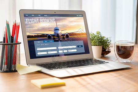 全世界个人电脑在线航班预订网站提供现代订票系统 n假期技术笔记本电脑飞机互联网屏幕人士展示办公室背景