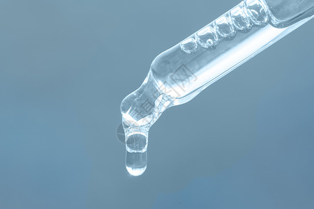 添加透明素材配有基本油的薄膜 含有酸的血清 蓝底的子宫颈酸背景