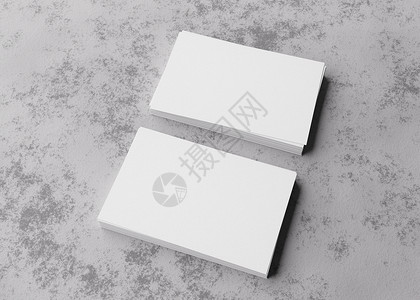 粗糙的混凝土表面上的空白白色名片 品牌标识的样机 两叠 展示卡片的两面 图形设计师的模板 自由空间 复制空间 3D 渲染背景图片