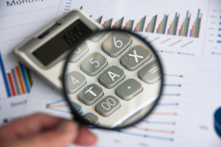 tax放大玻璃 重点是TAX关于计算器 商业和税务概念的工作背景