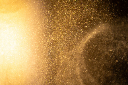 漂浮火花黑色背景上的金尘粒抽象布凯星粒子 在空间中的远期点背景