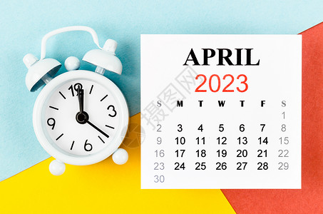 2023年4月的每月日历年 有多彩背景的闹钟背景图片