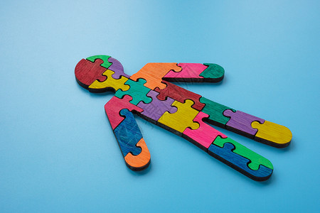 一个拼图素材一个人的图是由多色拼图片组成的 自闭症或神经多样性概念背景