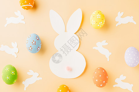 复活节蛋复活节鸡蛋兔子和兔子白纸切割背景