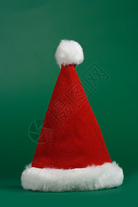 圣诞红帽子和白帽子 圣诞老人 红色的 假期 绿色的背景图片