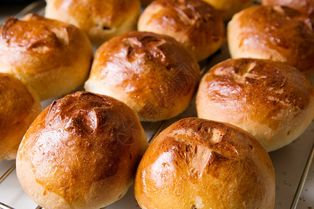 热交包 庆祝 烘烤 生产 面包 馋嘴 复活节 热十字 棕色的 假期背景图片