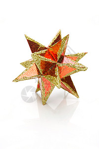 圣诞星 星星 喜庆的 装饰品 金子 假期 红色的背景图片