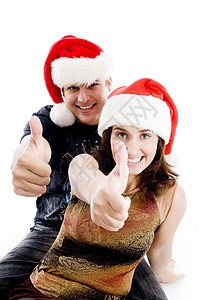 圣诞节戴帽子的人举起大拇指图片