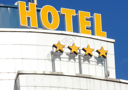 四颗恒星旅馆外表的详情 停留 服务 蓝色的 点燃的 生活背景图片