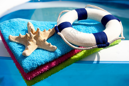夏季渔具 泳装 浮标 假期 齿轮 毛巾 闲暇背景图片