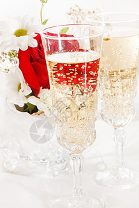 带鲜花的香槟 假期 婚礼 长笛 白色的 菊花 金子背景图片