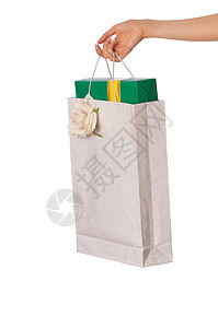装箱纸袋的纸袋 消费主义 礼物 女士 包 丝带 包装图片