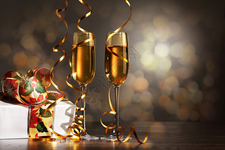 新年派对上香槟的玻璃杯 弓 液体 吐司 庆典 圣诞节图片