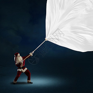 圣诞老人举旗 男人 假期 礼物 冬天 圣诞节 前夕 季节图片