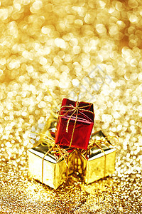 圣诞礼物 金的 黄色的 展示 圣诞节 闪光 假期背景图片