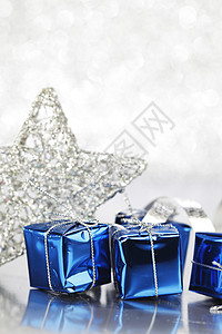 圣诞节装饰 火花 礼物 丝带 星星 新年 闪耀 弓 展示背景图片