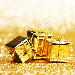 节日礼物盒 假期 丝带 装饰风格 盒子 问候语 弓 金的 黄色的背景图片