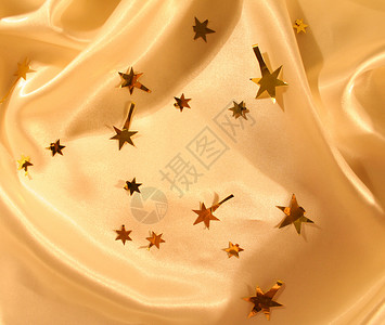 新年节日金丝作为背景 丝绸 金子 生产 星星 假期背景图片