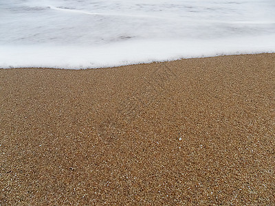 海浪逼近的沙滩沙滩图片