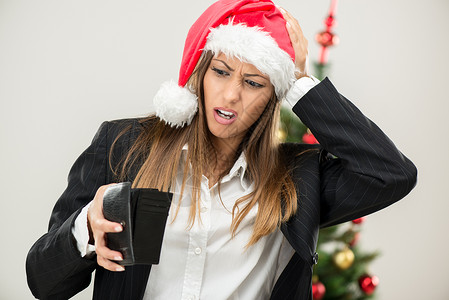 空空钱包 水平的 金融危机 空的 年轻女性 美丽的 圣诞帽背景图片