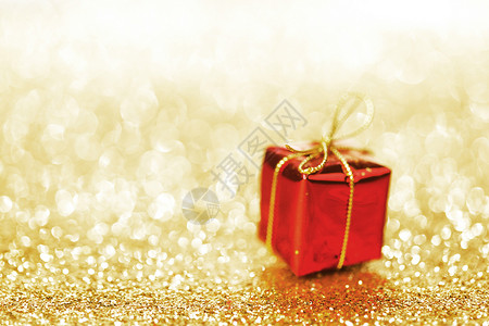 带节日 gif 的盒子 金子 装饰风格 金的 新年 黄色的背景图片