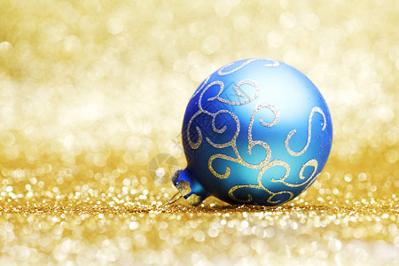 蓝圣诞舞会 火花 金的 玩具 背景虚化 喜庆的 闪亮的 蓝色的背景图片